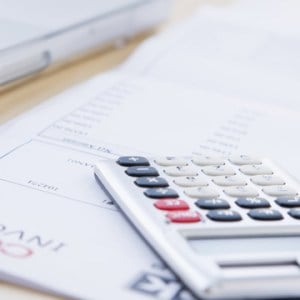 financial papers and a calculator