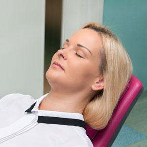 Woman asleep in dental chair
